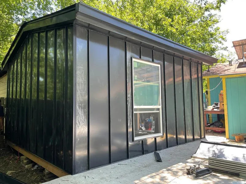 Black standing seam metal wall panels for Metal Roof Installation in Alpine