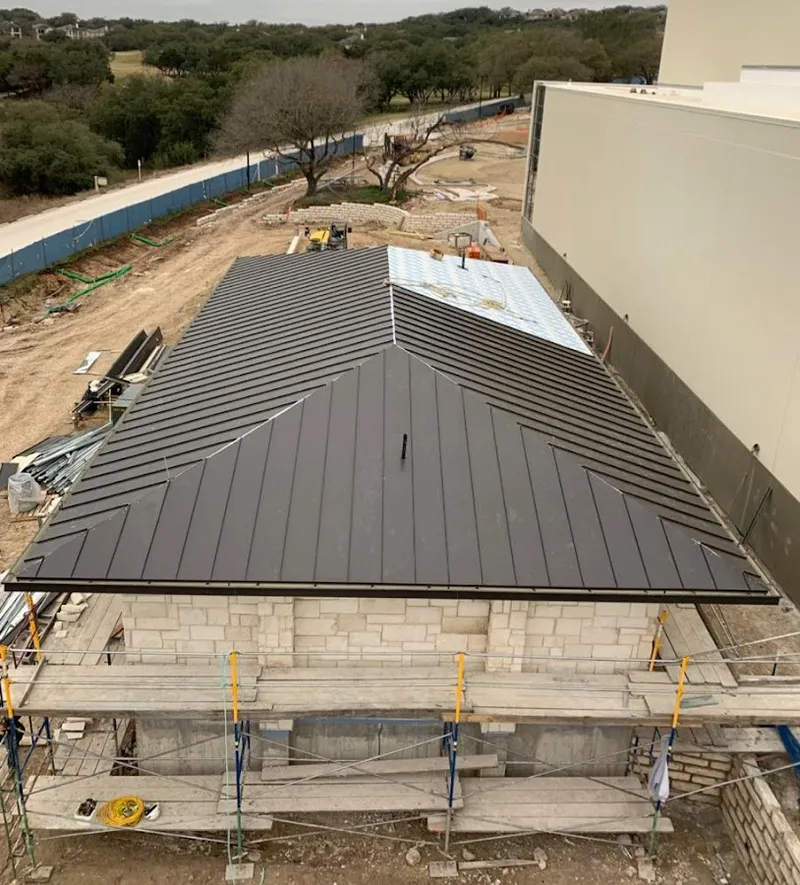 Metal roof new construction with scaffolding in Alpine
